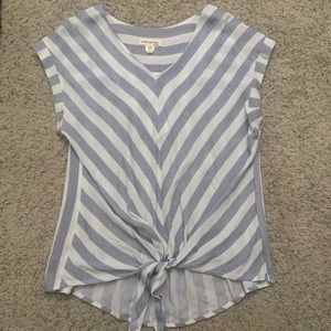 Striped gray and white top with open sleeves and top knot in the front